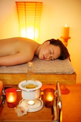 Obraz na płótnie Canvas Woman relaxing in massage salon