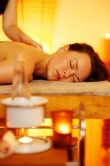 Obraz na płótnie Canvas Woman relaxing in massage salon