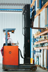warehouse forklift loader at work © Kadmy