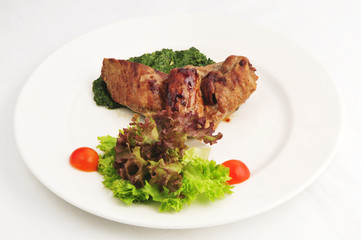 The fried meat with a garnish