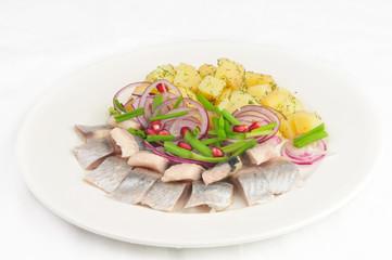 Boiled potato with a herring