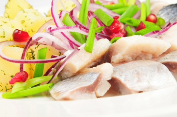 Boiled potato with a herring