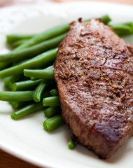 Closeup of steak with french beans
