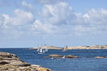 Sailboats at rocky coast