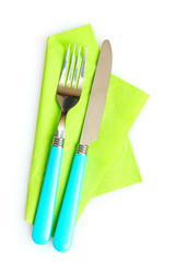 knife and fork on a napkin isolated on white