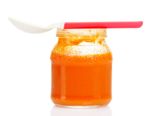 baby food and spoon isolated on white