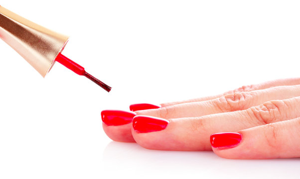 woman's hand and red lacquer isolated on white