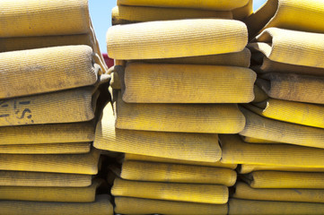 Up close view of a yellow fire hose on a firetruck