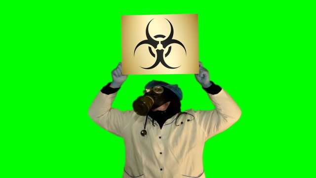 Chroma key anger persons in gas mask with board Biohazard