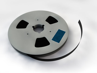 Reel of 35 mm motion picture film on white background