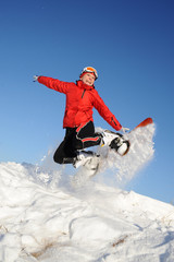 Fototapeta na wymiar woman jumping with snowboard