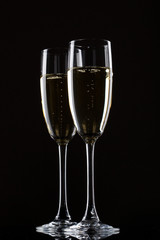 Champagne in glass isolated on a black background