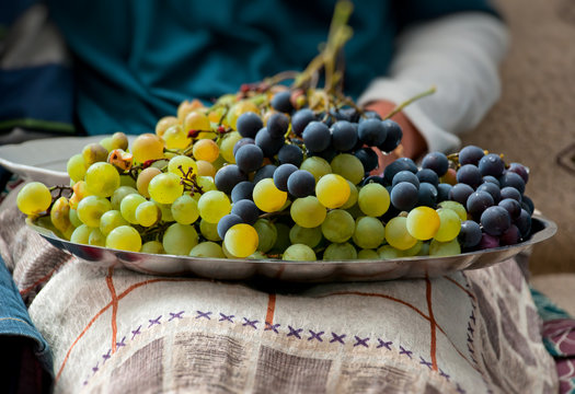 Plate Of Grapes On The Lap