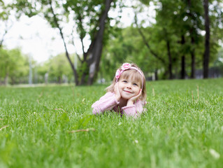 Fototapeta premium Portrait of a little girl outdoors