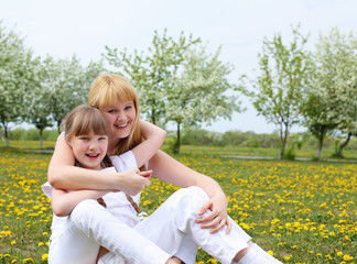 girl with mother in spring park