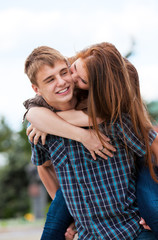 Obraz premium Young couple against the nature