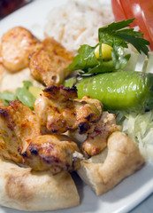 Turkish shish kebab rice green pepper pita bread plate