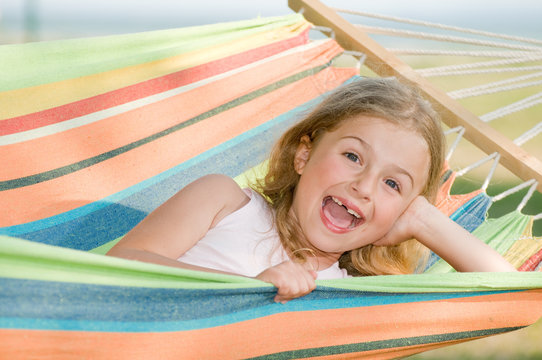 Summer vacation - girl with colorful hamock