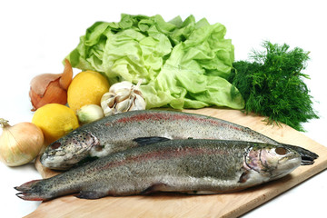 Fresh fish close up with vegetables