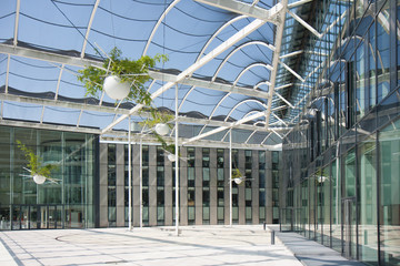 Open vestibule in a modern building with a roof of glass