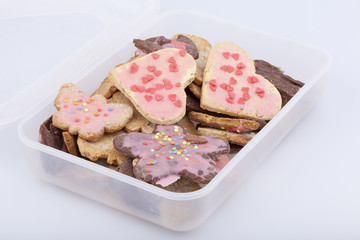 studio-shot of a food storage box full with cookies.