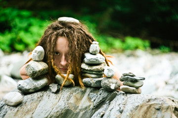 Woman portrait with stones. Nature wellness & SPA