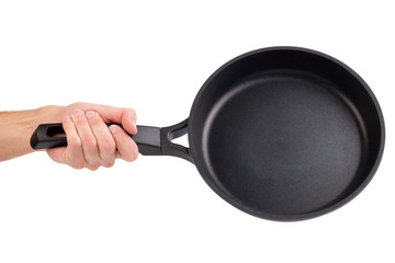 Frying pan in a hand isolated on white background