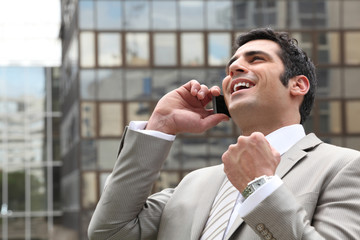 Businessman overjoyed with his phone call