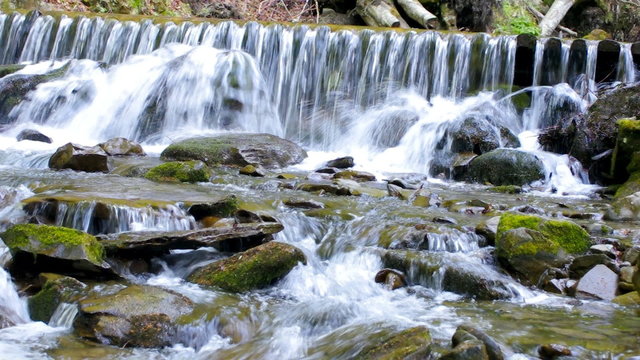 Closeup view of waterfall in mountain forest