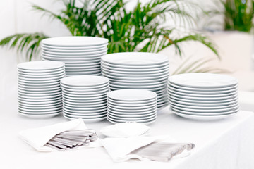 Stacks of plates for a buffet.