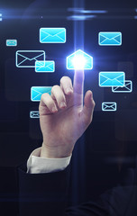 hand pushing a button on a touch screen interface