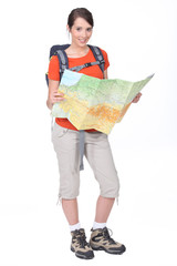 Female backpacker studying a map