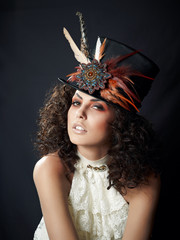 Portrait of a woman in a hat with feathers