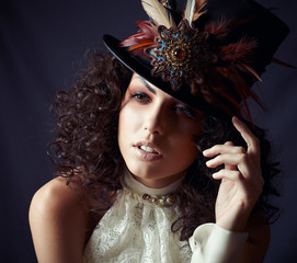 Portrait of a woman in a hat with feathers