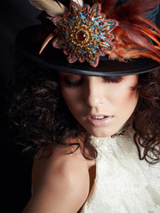 Portrait of a woman in a hat with feathers