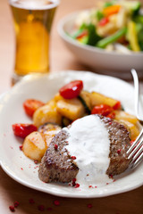 Steak with baked vegetables and sauce