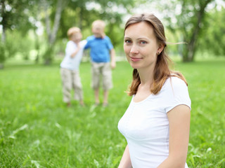 Portrait of mother with two sons on the background