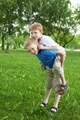 Naklejka na ściany i meble Portrait of two boys in the summer outdoors