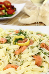 Tagliatelle pasta with salmon, anise and lemon