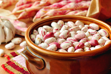Fresh beans in a clay bowl.