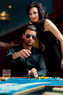 young man throwing poker chips