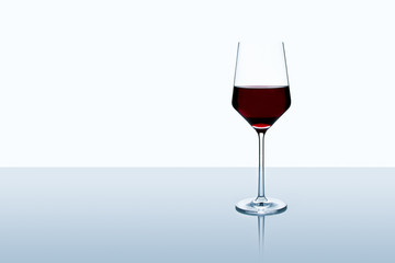 Red wine glass isolated on white background standing on a table