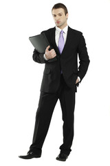 confident young businessman holding portfolio