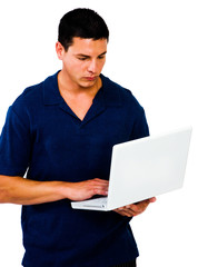 Caucasian man using a laptop