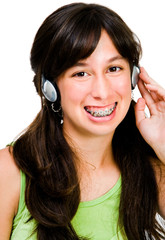 Naklejka premium Teenage girl listening music