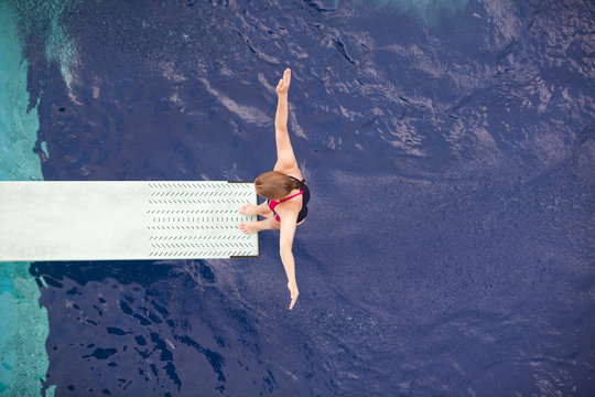 girl standing on springboard