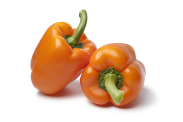 Whole fresh orange bell peppers