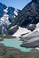 emerald lake near a mountain foot