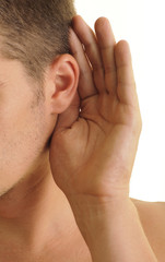 Man listening with his hand on his ear, isolated