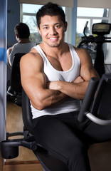 Fototapeta na wymiar Handsome man in gym room